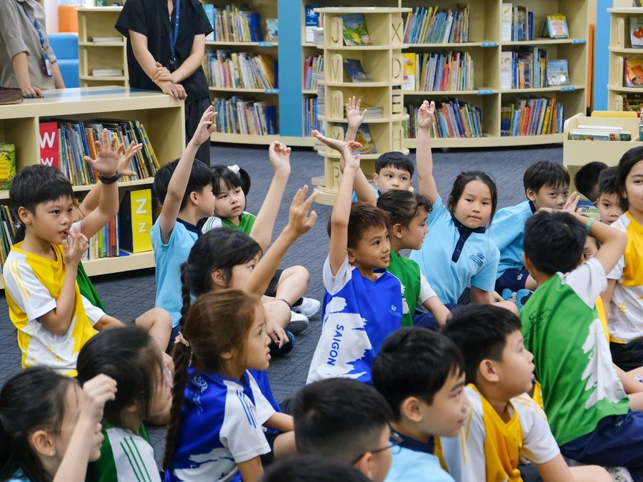Students raising hands during a nutrition workshop